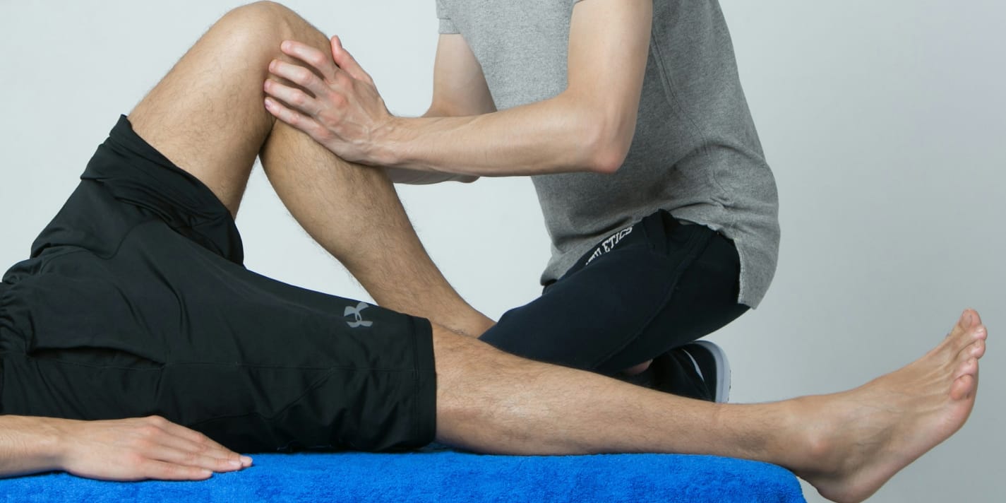 physical therapist working on a patient
