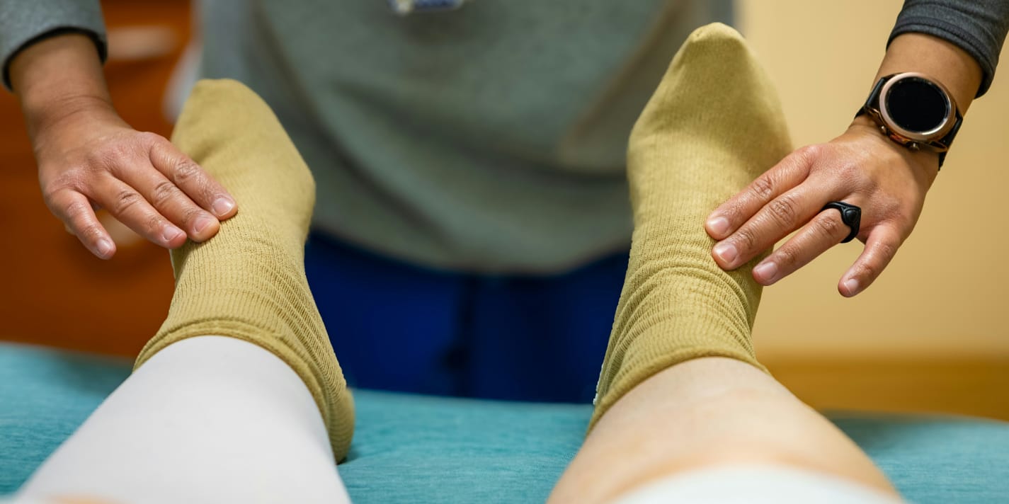 doctor examining patient's feet